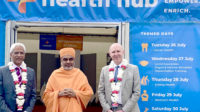 Mahendra Patel, professional advisor to England's chief pharmaceutical officer and part of Neasden Temple's health board, Pujya Yogvivekdas Swami, head priest at Neasden Temple, and David Webb, chief pharmaceutical officer for England