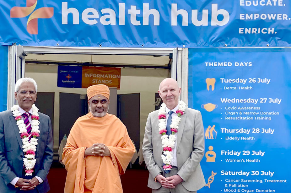 Mahendra Patel, professional advisor to England's chief pharmaceutical officer and part of Neasden Temple's health board, Pujya Yogvivekdas Swami, head priest at Neasden Temple, and David Webb, chief pharmaceutical officer for England