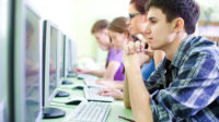 Students taking exam on their computers