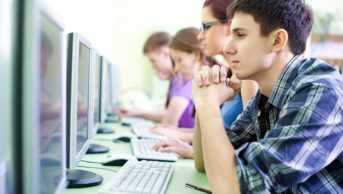 Students taking exam on their computers