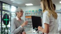 older woman at pharmacy counter