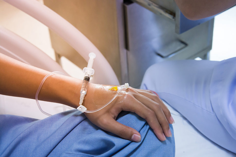 patient's hand receiving intravenous fluids