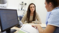 Nurse Discussing Test Results With Patient