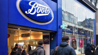 boots shop front on busy street