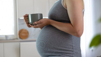 Pregnant woman with herbal tea