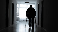 Disabled man in a hospital corridor
