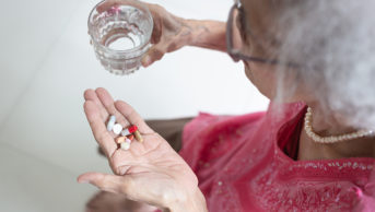 Older person taking medicines