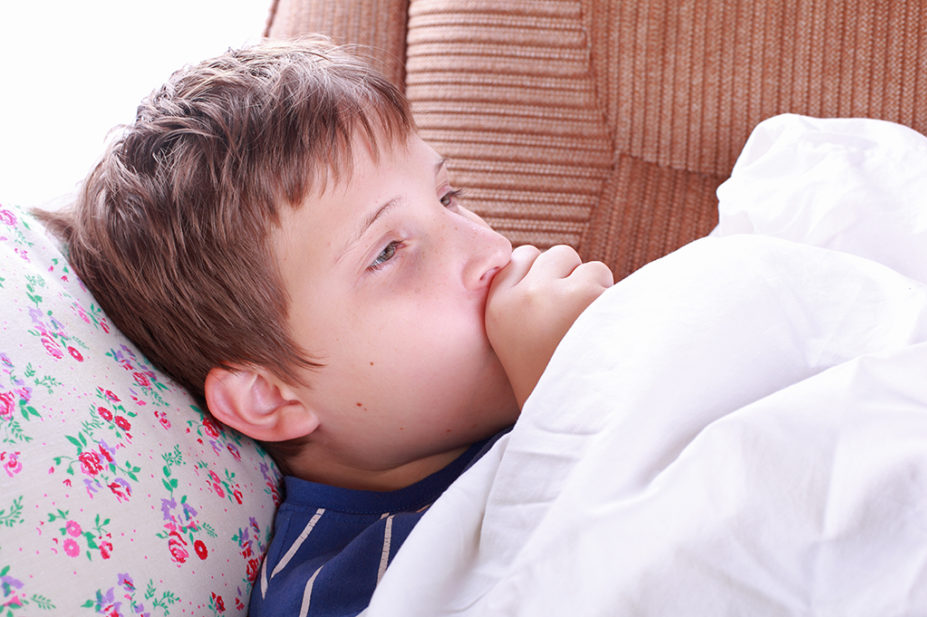 Child poorly in bed with pneumonia