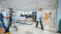 staff walking through hospital reception