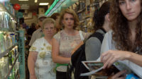 People queuing in a very busy pharmacy