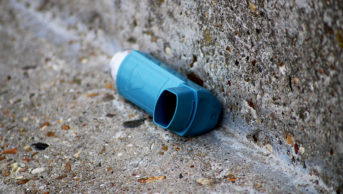A closeup shot of a thrown inhaler on the street