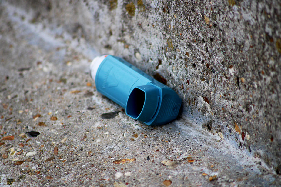A closeup shot of a thrown inhaler on the street