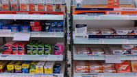 branded medicines on shelves in pharmacy