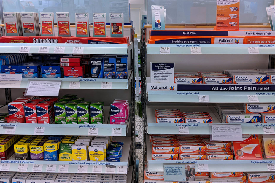 branded medicines on shelves in pharmacy
