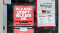 NHS medicine shortages. Poster in window of chemist