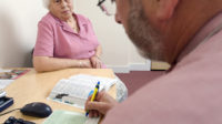 Pharmacist prescriber issuing a prescription to a patient