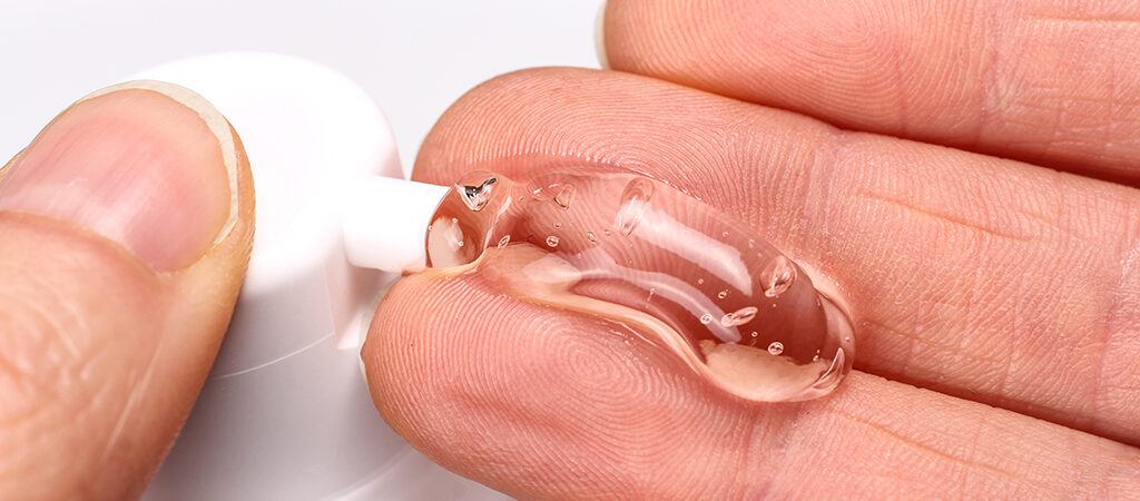 Woman applying testosterone gel to her hand