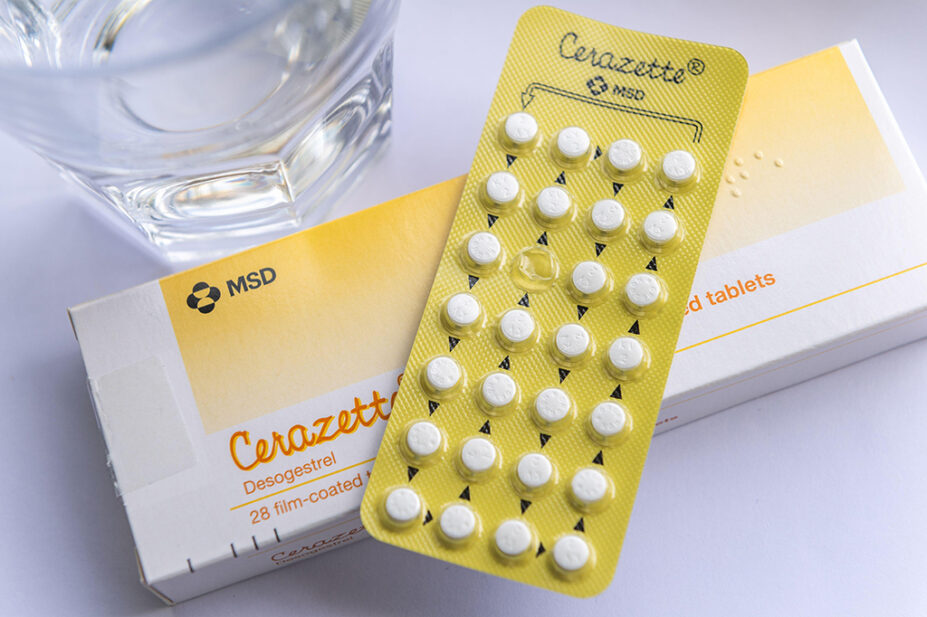 cerazette pill pack on top of box with glass of water