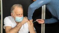 Older man having COVID-19 vaccination