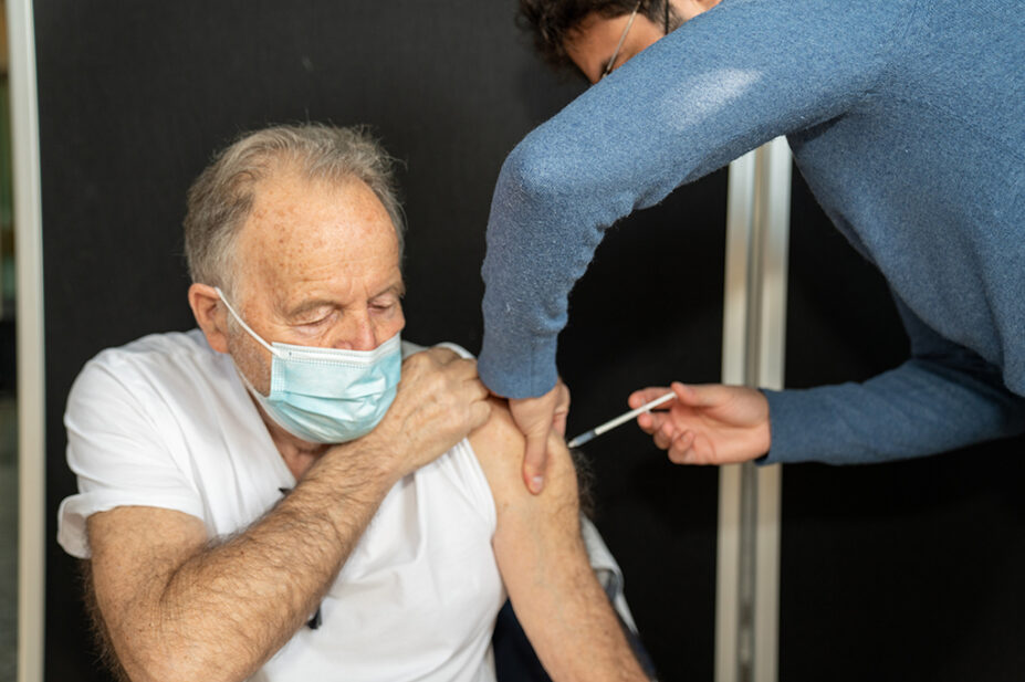 Older man having COVID-19 vaccination
