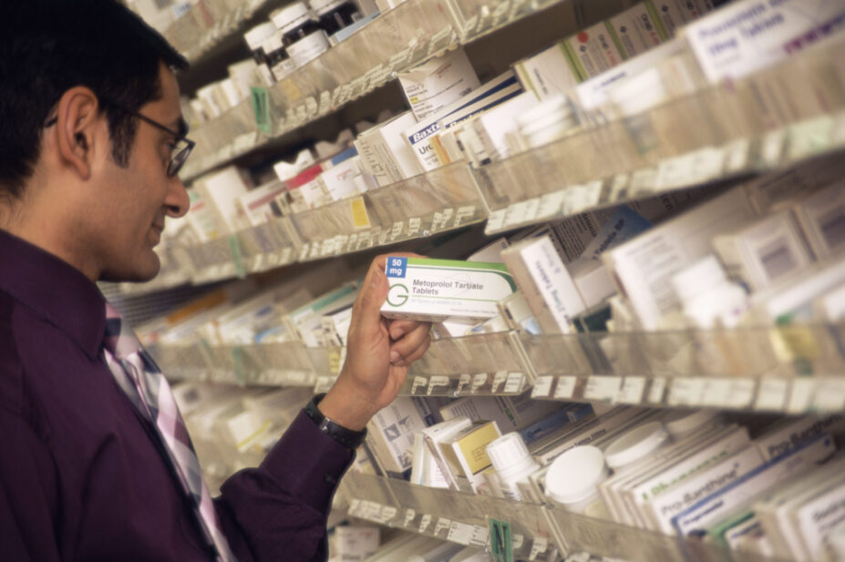 Hospital pharmacist selecting a drug