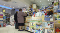 Customers at a pharmacy counter