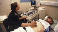Man undergoing an abdominal ultrasound scan
