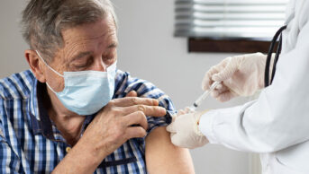Older man getting influenza vaccination