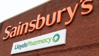 sainsbury's and lloydspharmacy signs on wall