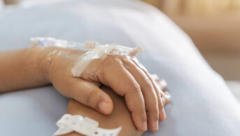 chemotherapy intravenous drip in patient's hand