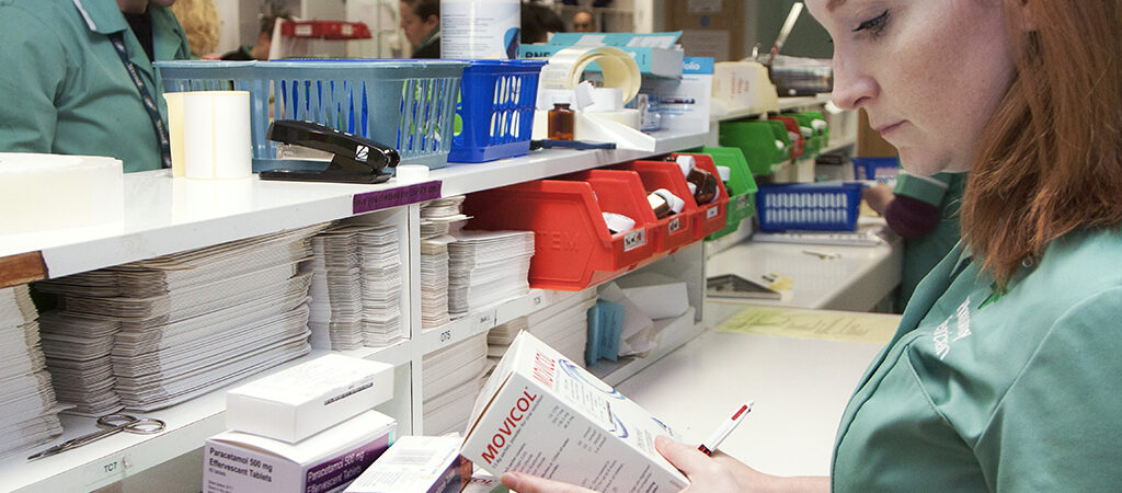 pharmacy technician checking medicine