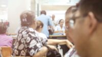 Blurred photo of people waiting in a community clinic