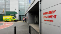 hospital emergency department exterior with ambulance parked outside