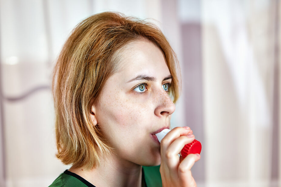 woman using dry powder inhaler