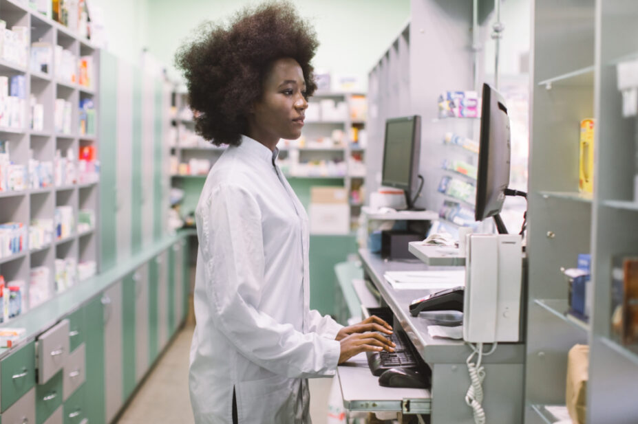 Side,View,Portrait,Of,Young,Confident,Concentrated,African,Female,Pharmacist,
