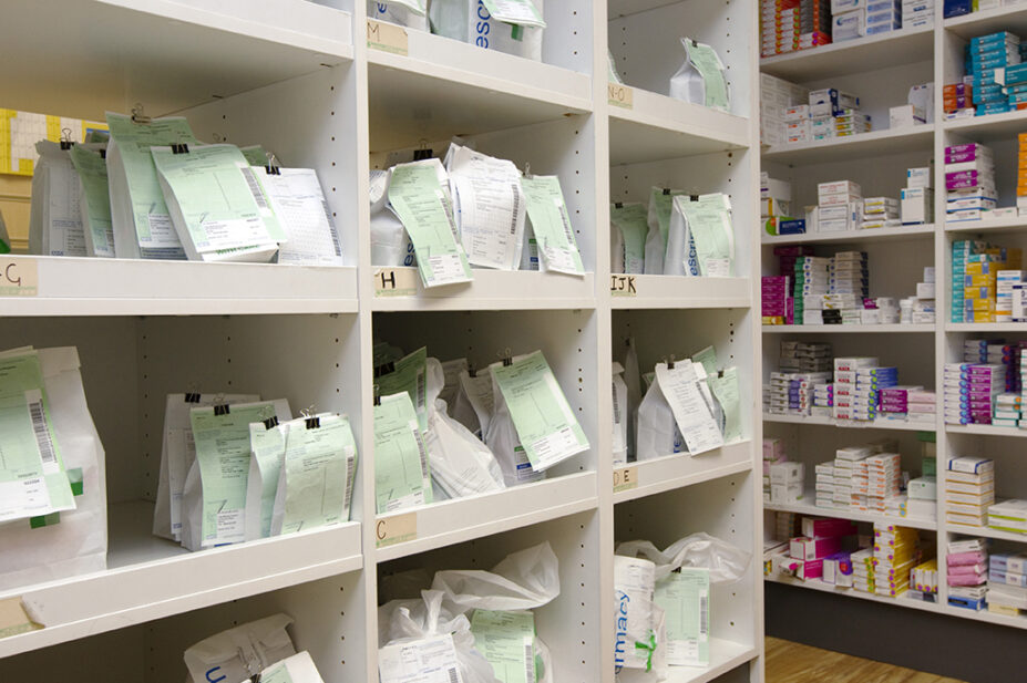 prescription bags on pharmacy shelves