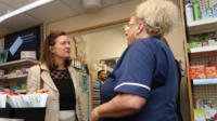 eluned morgan speaking to staff member at electronic prescription launch