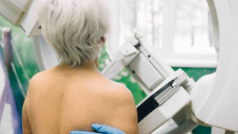 Older woman having a mammography scan at hospital