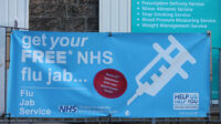 Flu vaccination banner outside a pharmacy in Lancashire