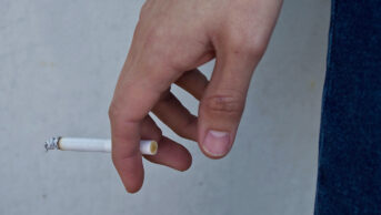 Close up of someone smoking a cigarette