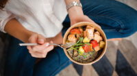 Woman sitting with a healthy meal