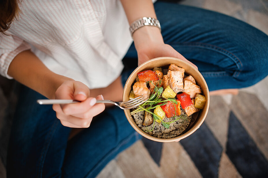 Woman sitting with a healthy meal