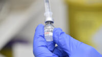 vaccine being drawn from vial