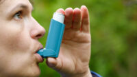 woman using saba inhaler