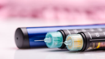 Insulin pen against white background