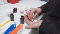 Pharmacy technician preparing prescriptions at a pharmacy.