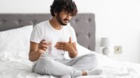 Unhappy millennial Indian guy suffering from heartburn