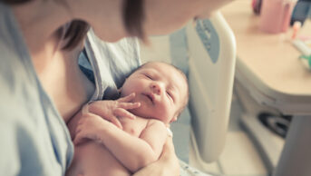 Woman with newborn baby