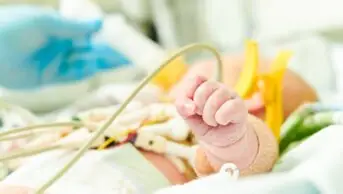 Newborn baby in incubator at neonatal resuscitation centre