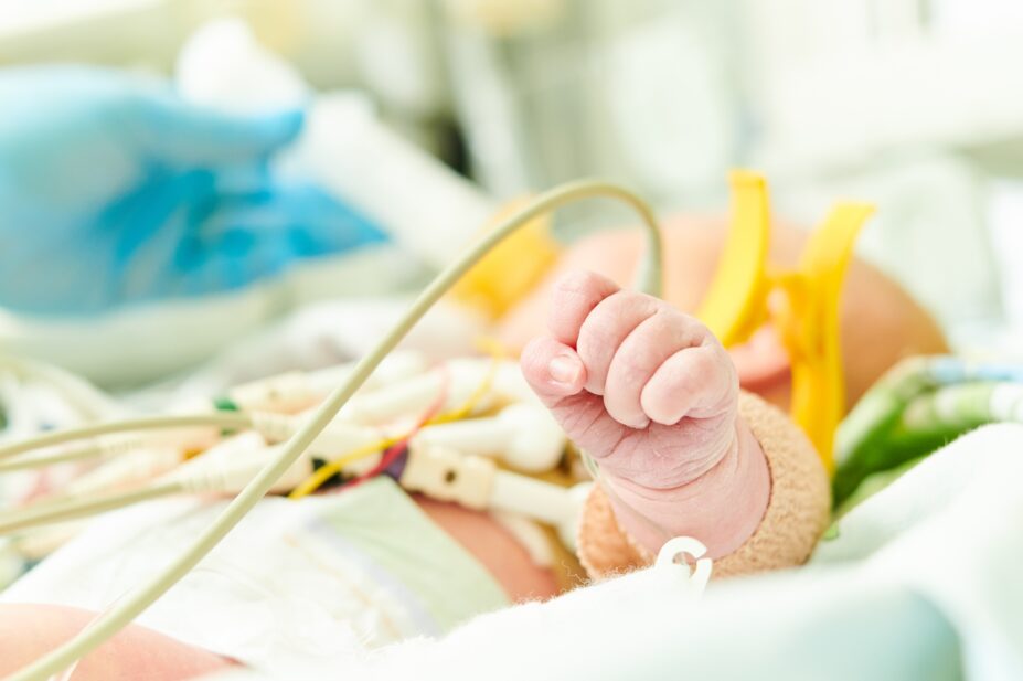 Newborn baby in incubator at neonatal resuscitation centre